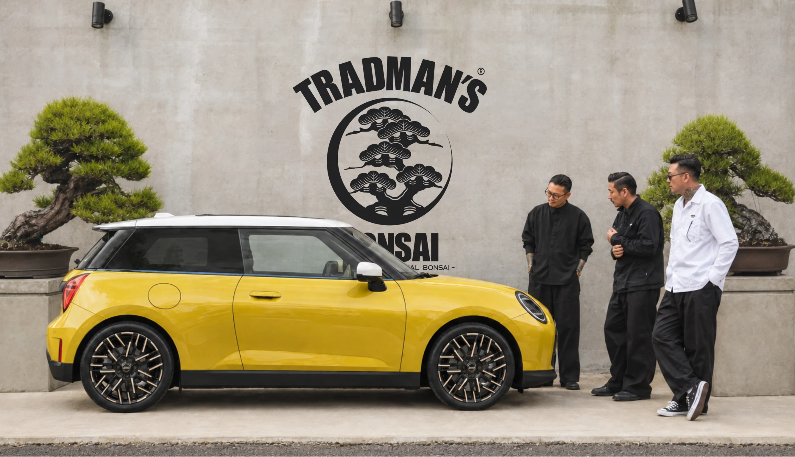 The yellow MINI Cooper 3 Door with the TRADMAN’S crew outside the atelier